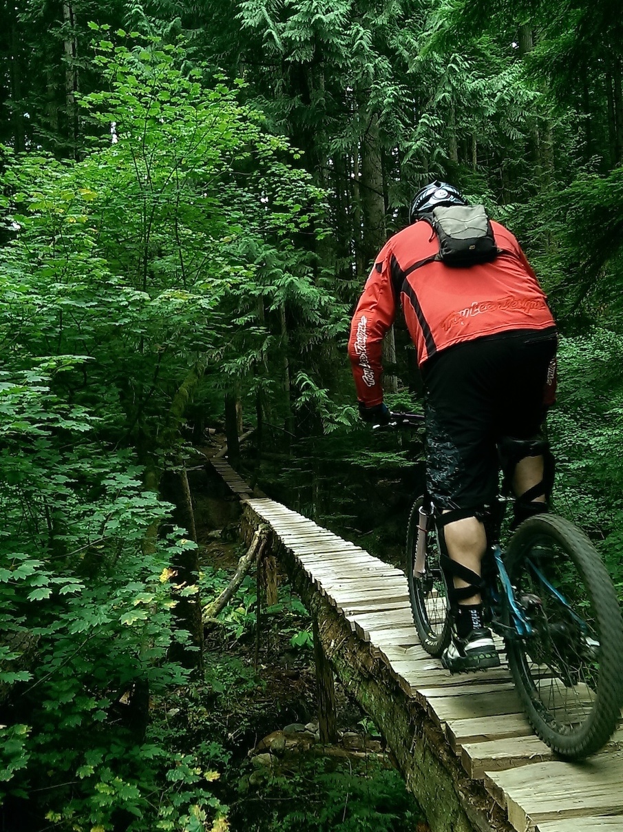 Mountain biking on a tall skinny feature